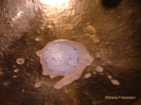more soapy water draining in sink