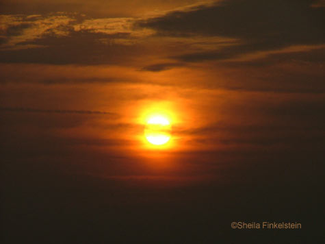 cloud covered sun at sunset